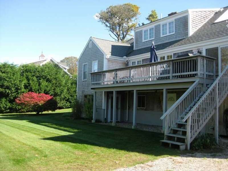 Exterior back of house and green grassy lawn -13 Monomoy Circle- Chatham- Cape Cod- New England Vacation Rentals