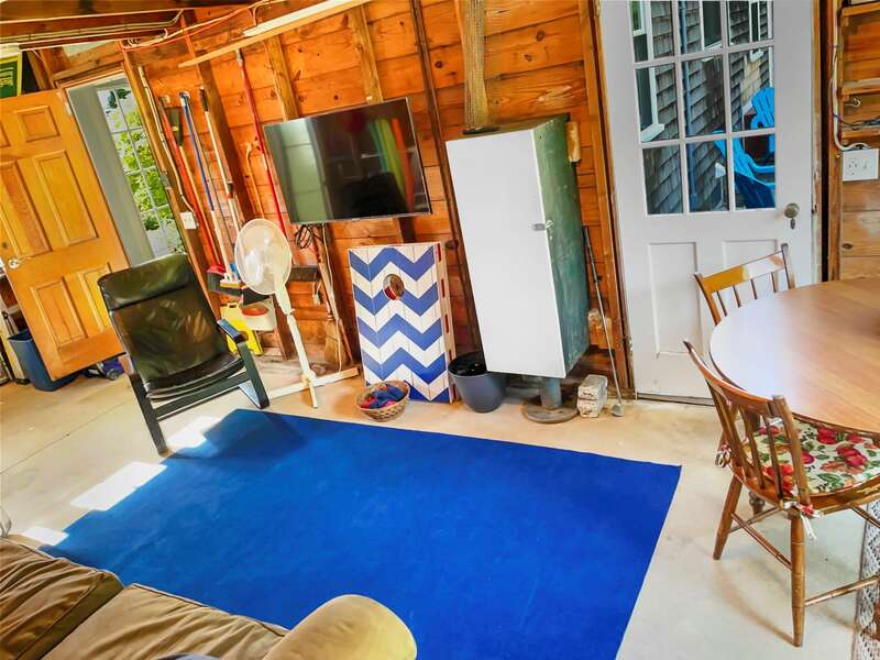 Game Room off of the kitchen/entry also leads to the backyard living space -54 Hiawatha Road Harwich Port Cape Cod New England Vacation Rentals