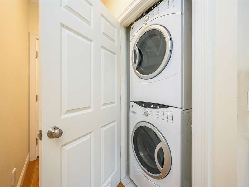 Stackable washer and dryer in hallway closet off of kitchen-2 Captains Row E Chatham Cape Cod New England Vacation Rentals-#BookNEVRDirectCaptainsRow