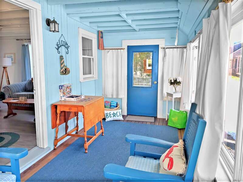 Enjoy your favorite book on this porch offering easy access to come and go to the beach from the side door - 17 Ocean Avenue Harwich Port Cape Cod New England Vacation Rentals