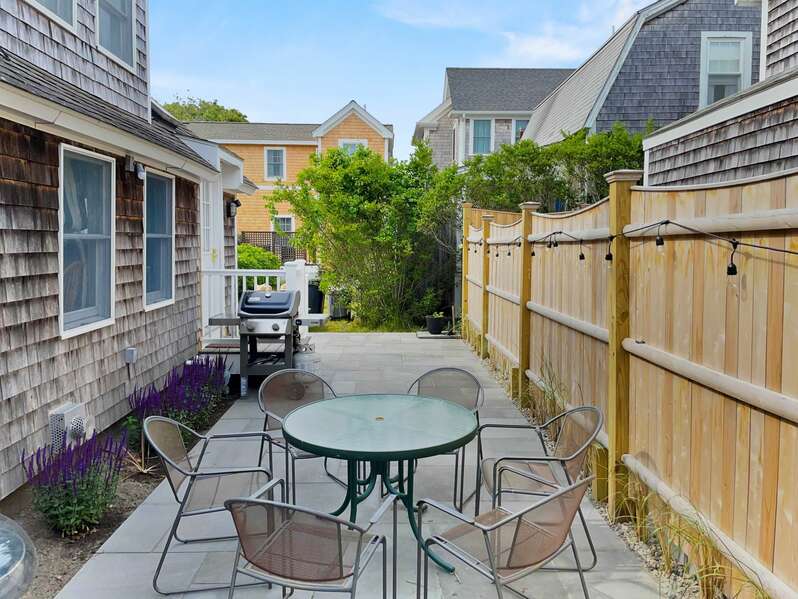 Quaint back patio dining area with a gas grill - 17 Ocean Avenue Harwich Port Cape Cod New England Vacation Rentals