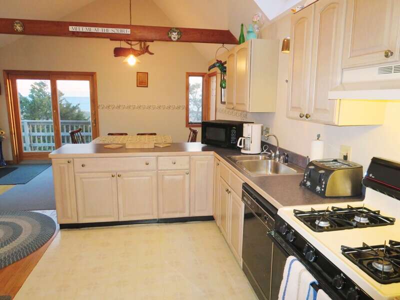 Open and fully equipped kitchen with sliders to the deck - 17 Uncle Venies South Harwich Cape Cod New England Vacation Rentals