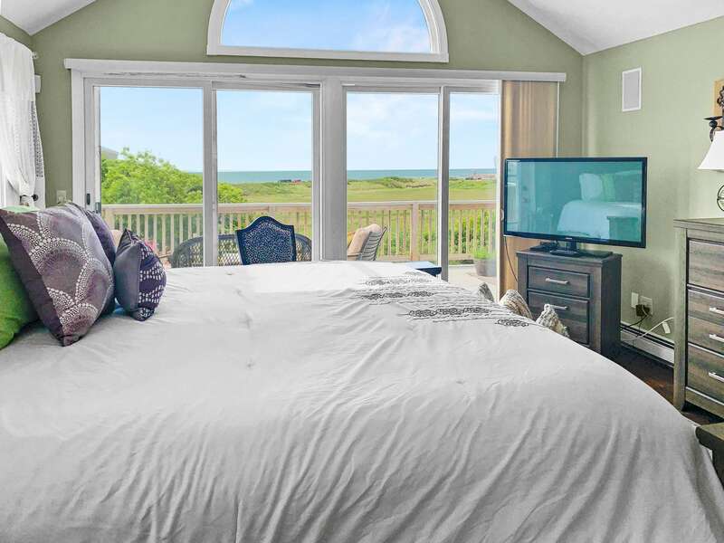 Master suite on the 2nd floor with a King bed, flat screen TV, en suite full bathroom, and sliders to the deck! - 19 Bob White Lane South Harwich Cape Cod New England Vacation Rentals