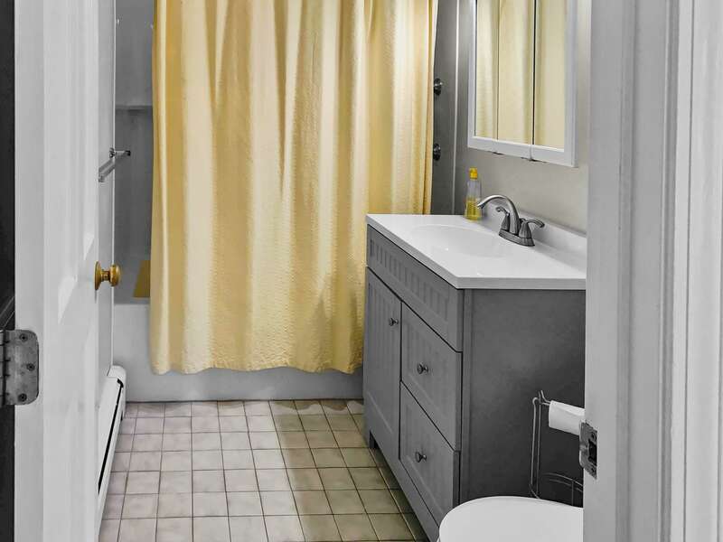 Newly updated bath off of the hallway on the 1st floor with a tub and shower - 19 Bob White Lane South Harwich Cape Cod New England Vacation Rentals