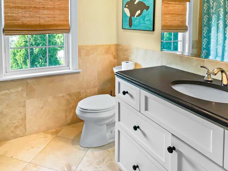 Full bathroom with a tub and shower on the 2nd floor off of the hallway - 32 Bearses By Way- Chatham Cape Cod New England Vacation Rentals