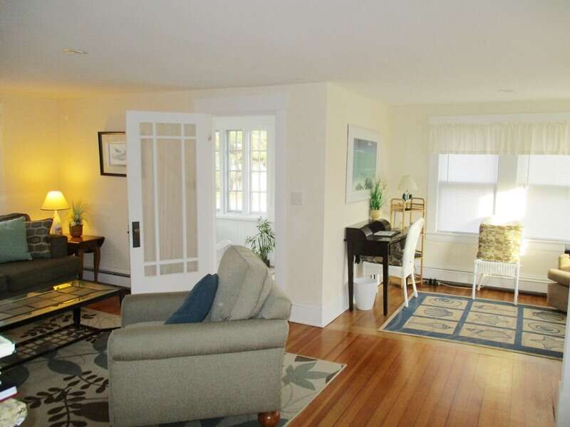 The open living area offers easy access to the sunporch - 36 Cross Street Harwich Port Cape Cod New England Vacation Rentals