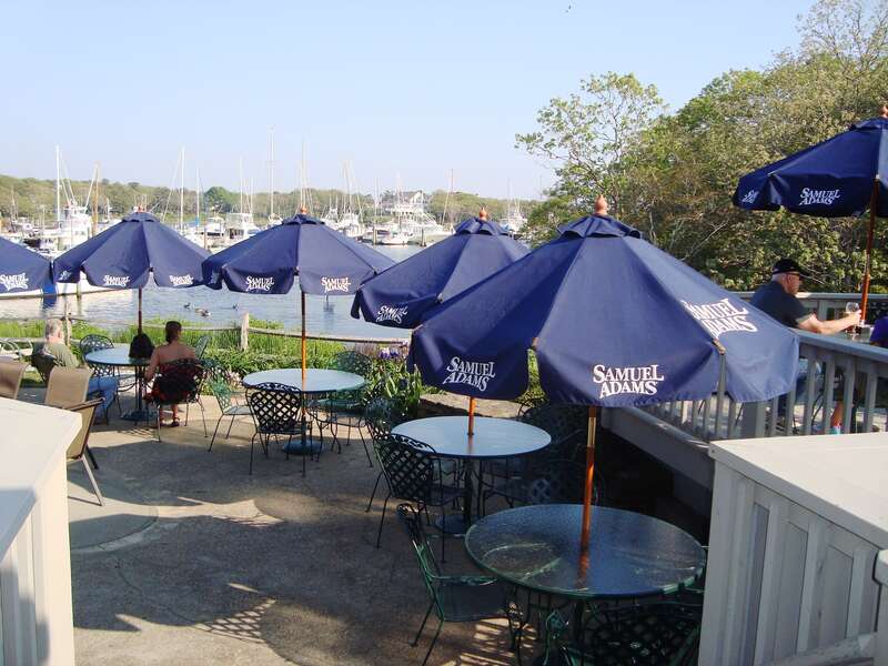 Have dinner on the patio at Brax Landing overlooking Saquatucket Harbor - Harwich Port Cape Cod New England Vacation Rentals