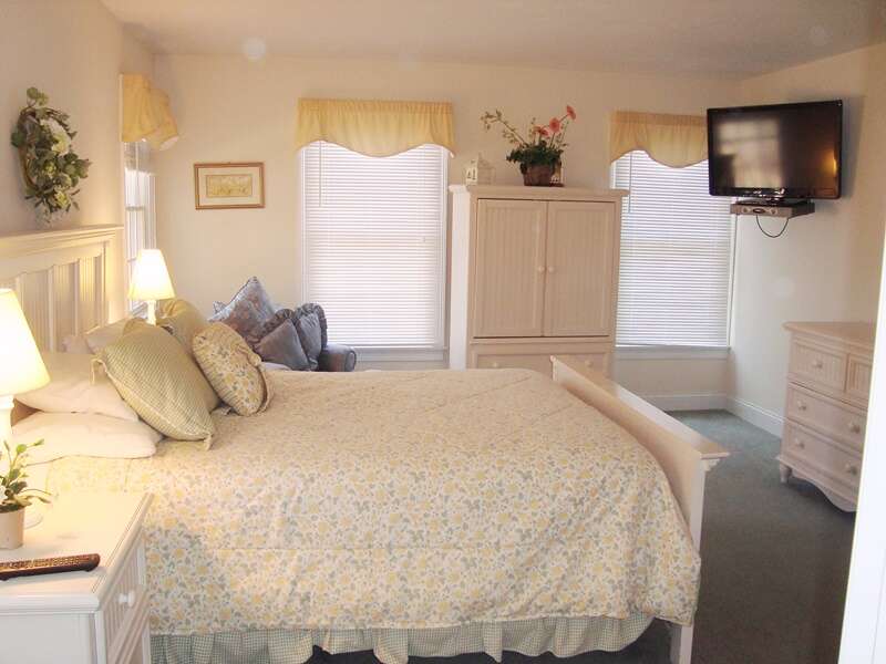 Main Floor Bedroom #1 with Queen Size Bed and TV + En suite Bath - 118 Deep Hole Road South Harwich Cape Cod New England Vacation Rentals