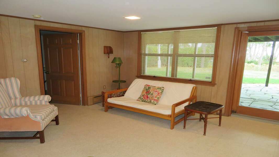 sitting area on Lower level - door to washer/Dryer room- Waterfront North Chatham Cape Cod New England Vacation Rentals