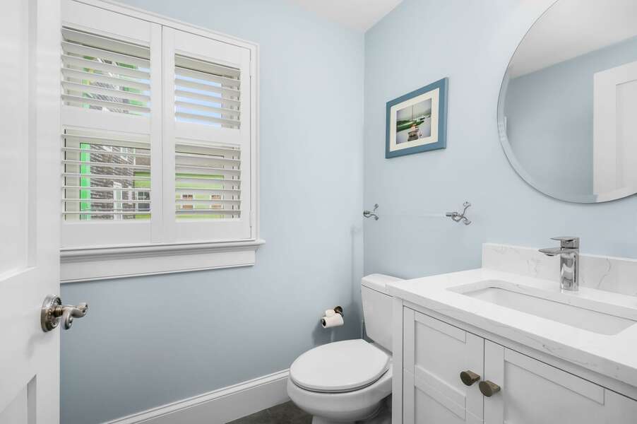Half bathroom off of hallway near kitchen and laundry area  - 201 Main Street Chatham Cape Cod - Sandpiper - NEVR