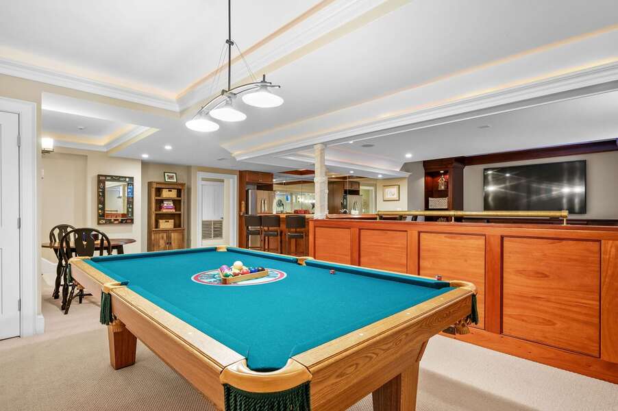 Lower level entertainment area with bar, pool table, game table, TV area and bathroom #5 - 201 Main Street Chatham Cape Cod - Sandpiper - NEVR