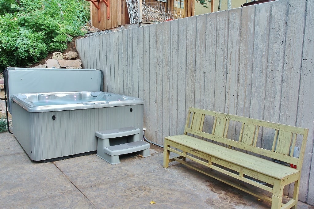 Back yard heated patio with 100-jet hot tub