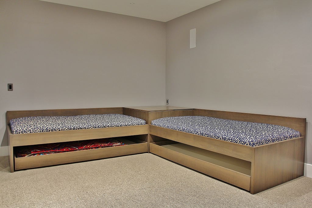 Large den/theater room with two XL Twin beds and two XL twin tuck under trundle beds