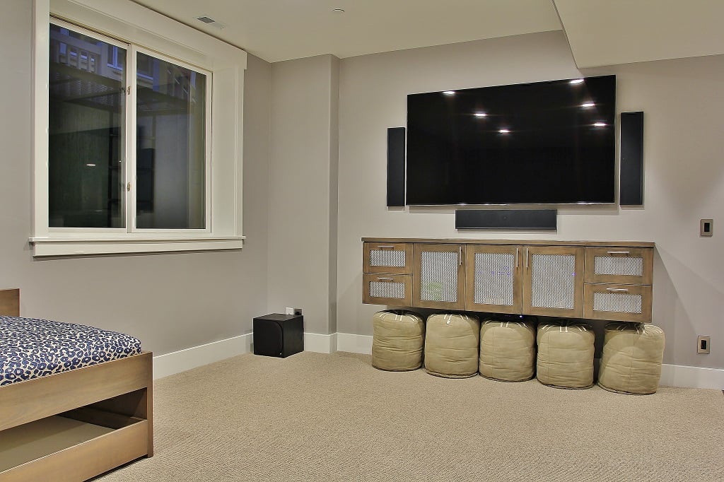 Theater room/den with 80