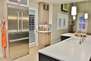 Gourmet display kitchen with stainless appliances and with Chef style culinary supplies