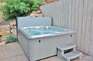 Back yardheated patio with new 7-seat 100-jet hot tub
