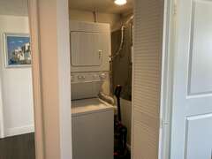 Stacked washer/dryer in hall closet