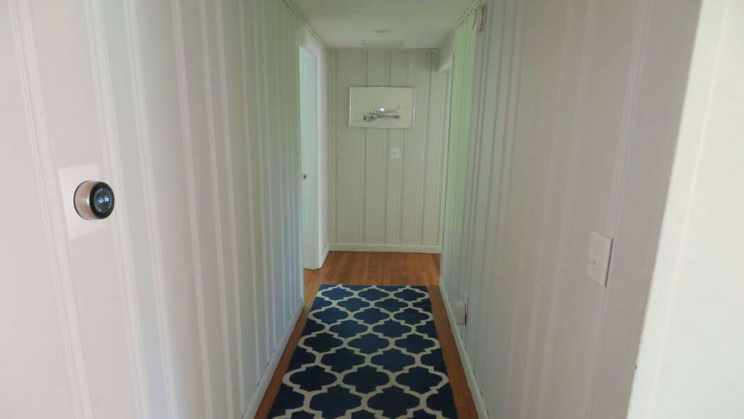 Head down the hall on the main floor to find the full bath and 3 bedrooms -14 Capri Lane -Chatham Cape Cod- New England Vacation Rentals