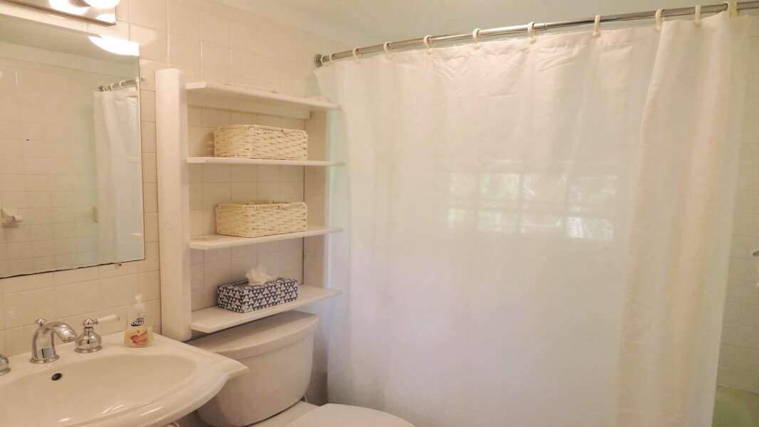 Bathroom 1 with a tub and a shower on the 1st floor - 14 Capri Lane -Chatham Cape Cod- New England Vacation Rentals