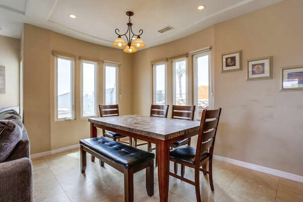 Dining Table, Bench, Chairs, and Windows.