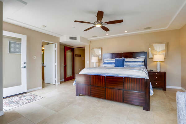 Large Bed, Nightstands, Ceiling Fan, and Lamps.