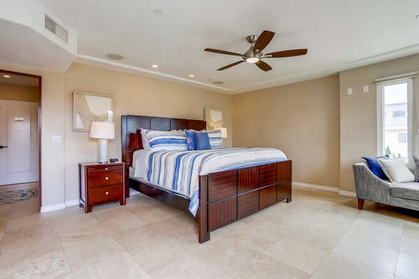 Sofa, Large Bed, Nightstands, Ceiling Fan, and Lamps.
