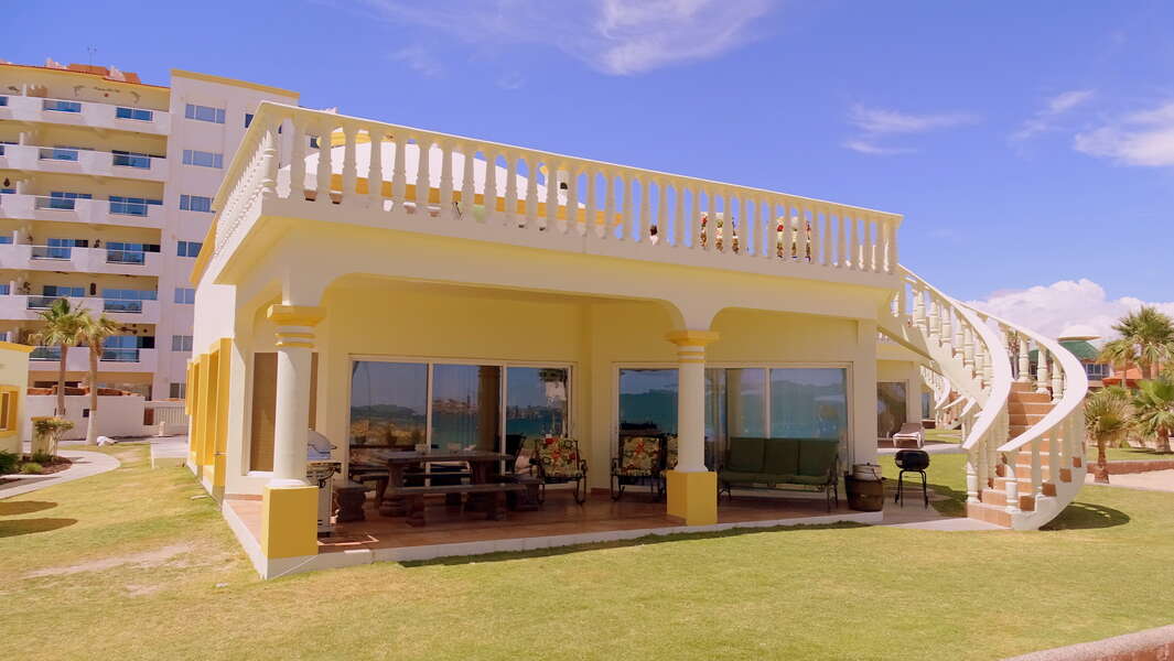 View of beautiful Villa 15 from the beach. No shoes needed here - you're steps from the sandy shores!