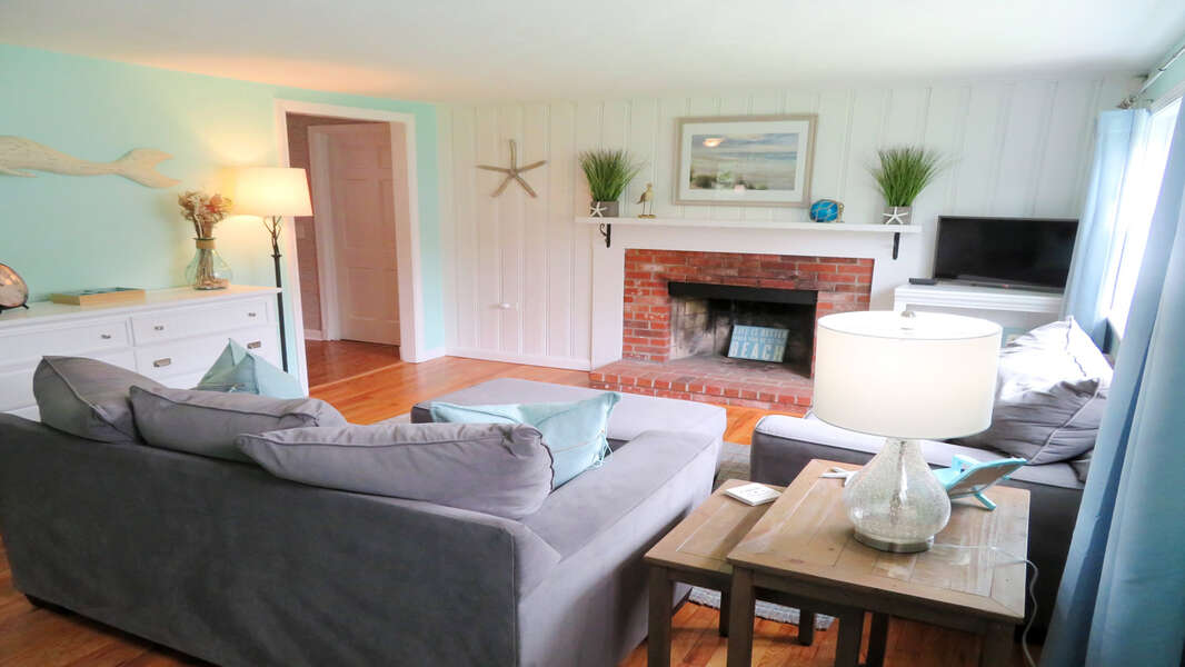 Entering the home you will find an inviting seating area with fireplace - 13 Carol Lane West Harwich Cape Cod New England Vacation Rentals