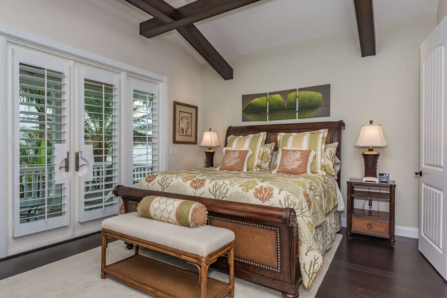 Spacious master bedroom with king sized bed, flat screen TV, walk-in closet, french doors to the private patio and private master bath.