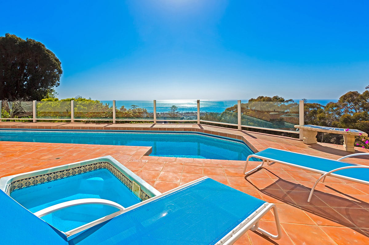Hot tub and heated pool with stunning views of the Pacific Ocean