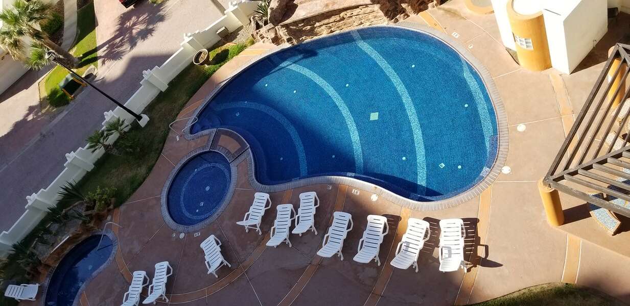 Swimming pools & jacuzzi below balcony