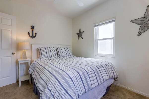 Guest Bedroom Receives Natural Light From Windows.