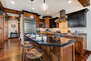 Fully Equipped Gourmet Kitchen with Stainless Steel Appliances and Granite Countertops.  Bar Seating for 3