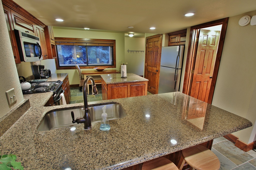 Kitchen with stainless steel appliances and granite counter tops in Park City Racquet Club Village - Park City