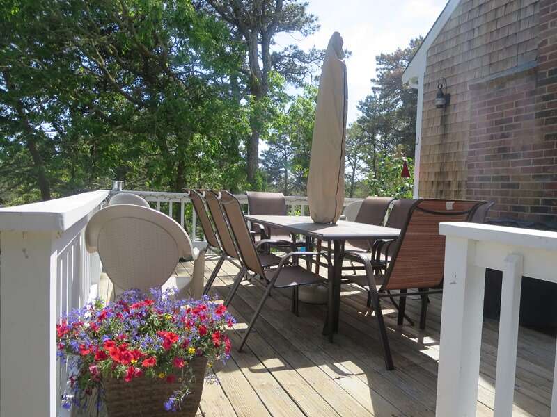 Twinkling lights surround the deck, you will love the outdoor living at this home! - 93 Pine Ridge Road Chatham Cape Cod New England Vacation Rentals