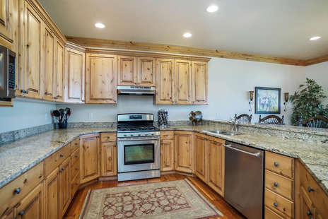 Fully stocked kitchen with appliances, cookware, general spices