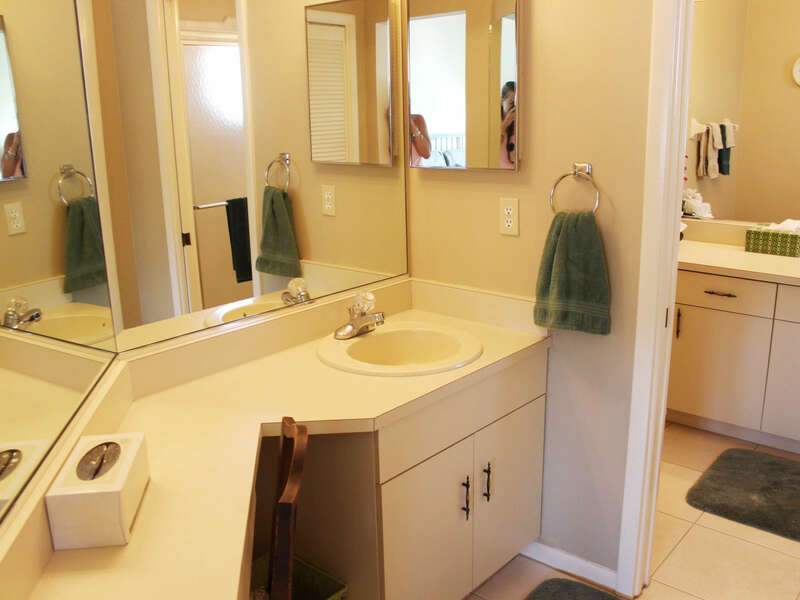Master bath with separate vanity, walk-in closet, with additional vanity with walk-in shower.