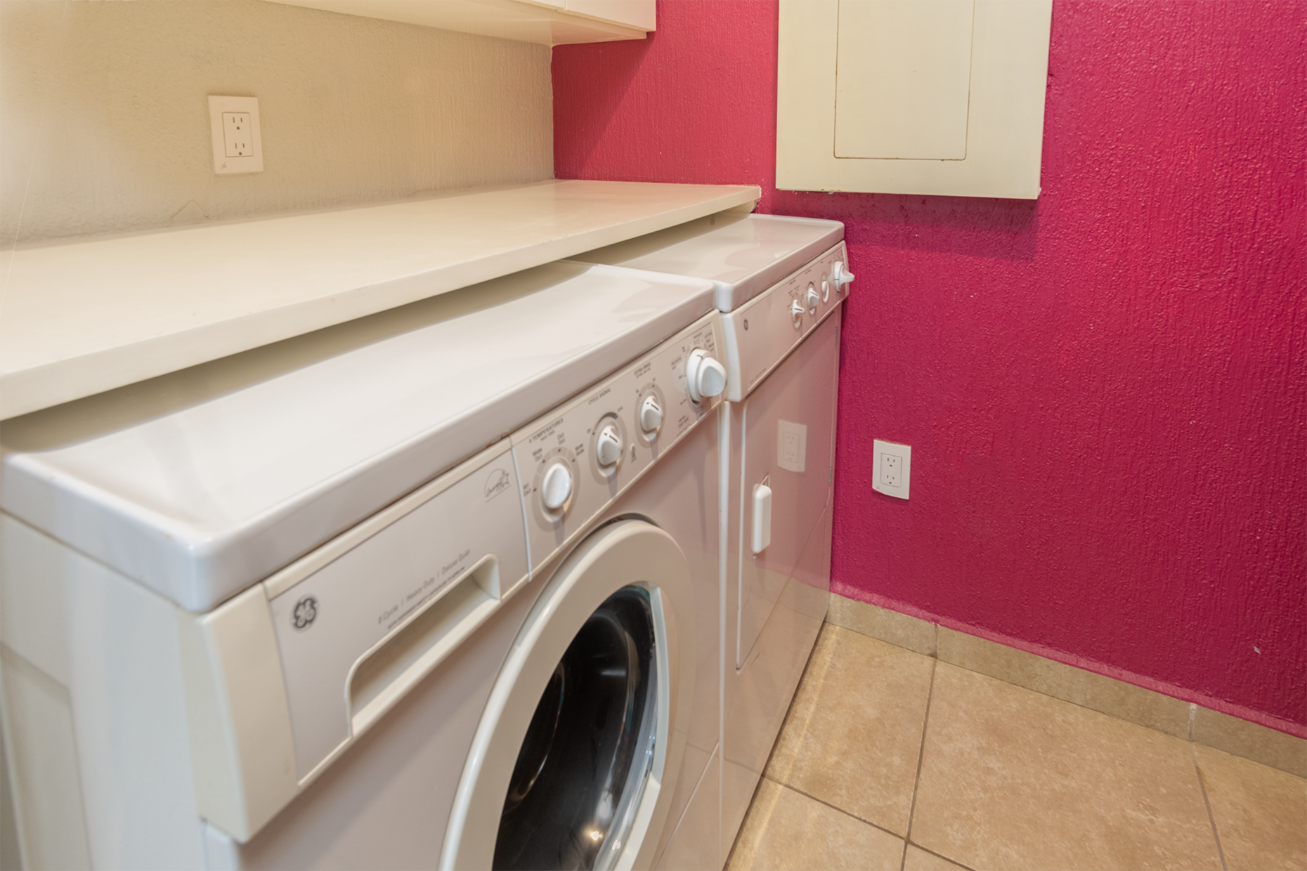 The utility room has a full sized washer and dryer.