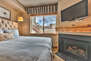 Bedroom 2 with Two Queen beds, a Warm Gas Fireplace, and Mountain Views