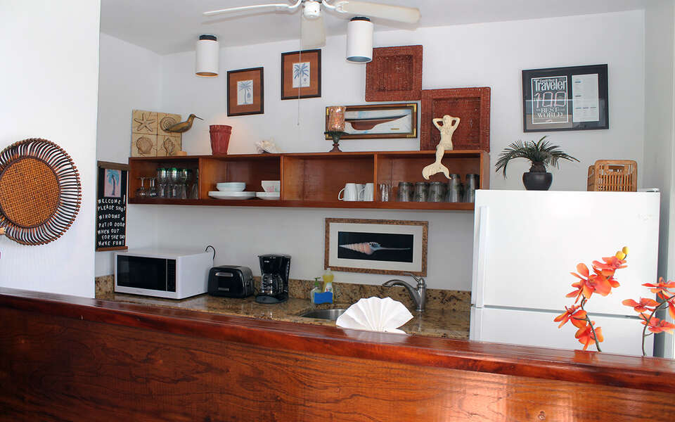 Natural wood bar view of kitchen