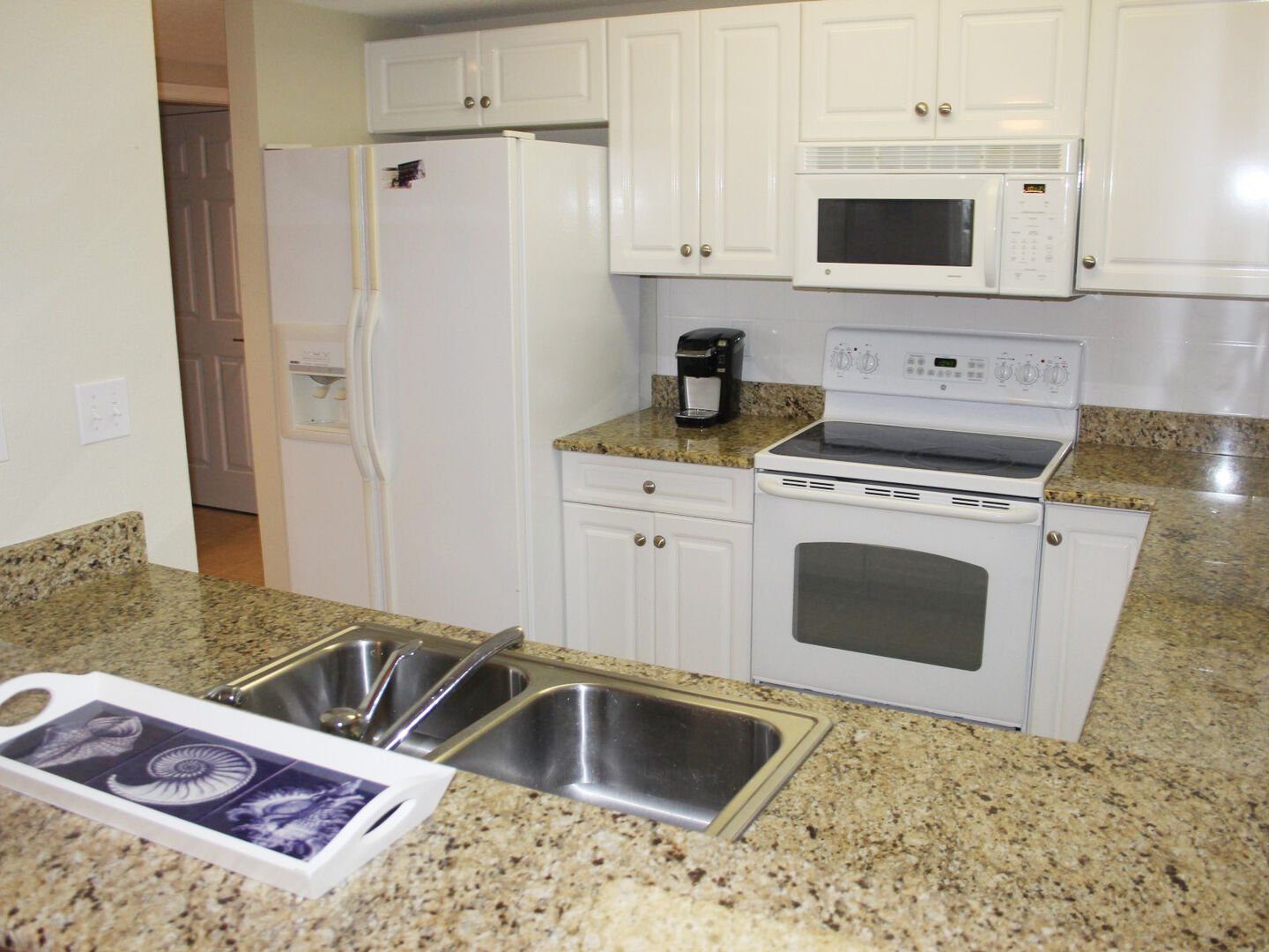 Fully equipped kitchen with granite counter tops.