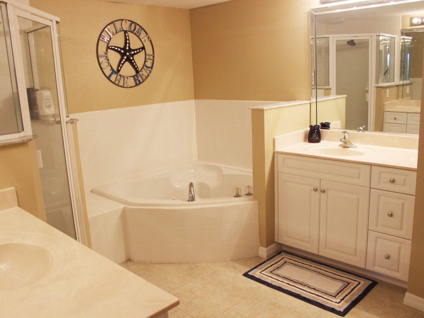 Private master bath with garden tub, walk-in shower and his/her sinks.