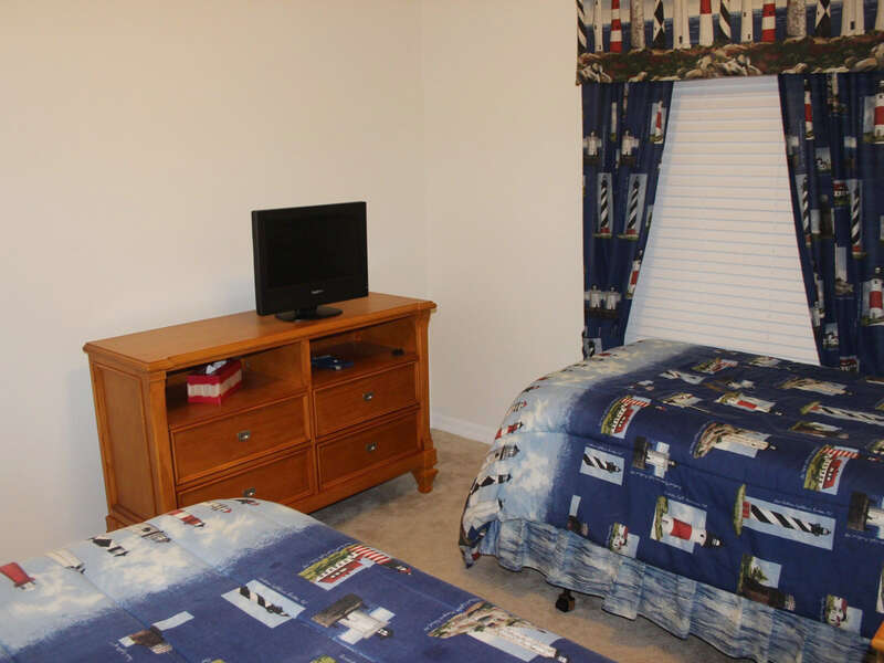 The 3rd bedroom also features a flat screen TV.