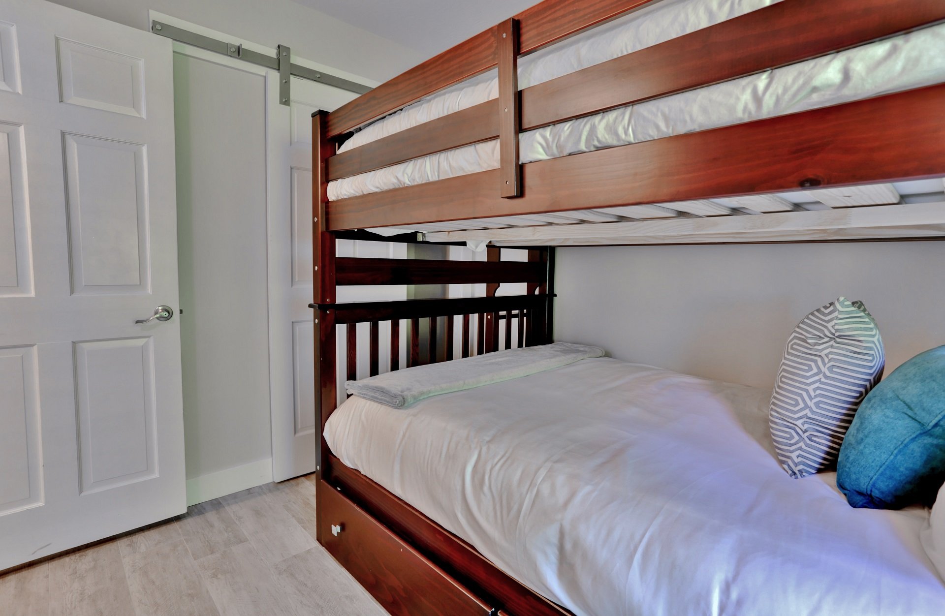 Lower level Bunk Bedroom with full over full bunk bed, 40' HD LED Smart TV and private ski-in deck/access