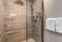 Main level Master Bathroom with rainwater tile/stone shower and raised vessel vanity