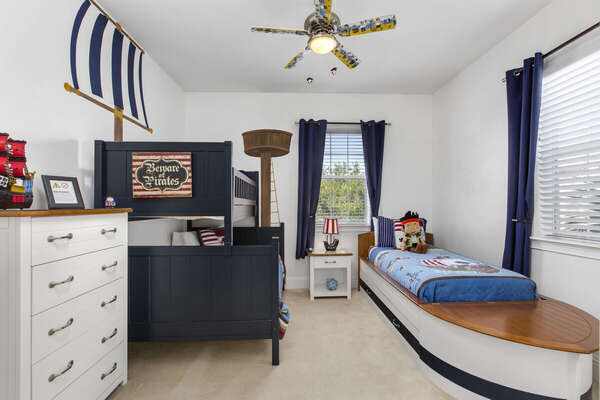 Bedroom 6 is a Pirate themed room ideal for boys or girls. It has a Pottery Barn Camp Twin-Over-Full Bunk bed and an additional twin boat bed