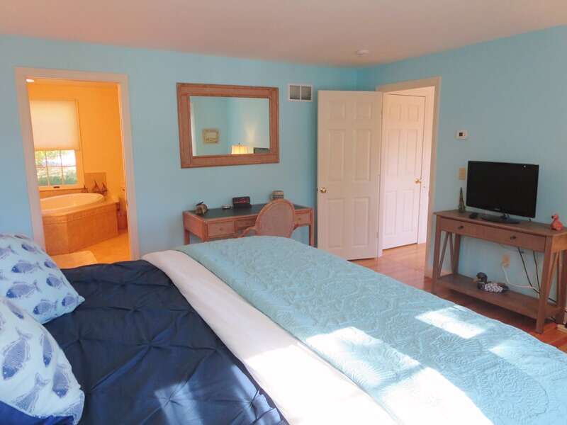 1st floor master bedroom with king bed + tv and ensuite bath- 151 Sky Way Chatham Cape Cod New England Vacation Rentals