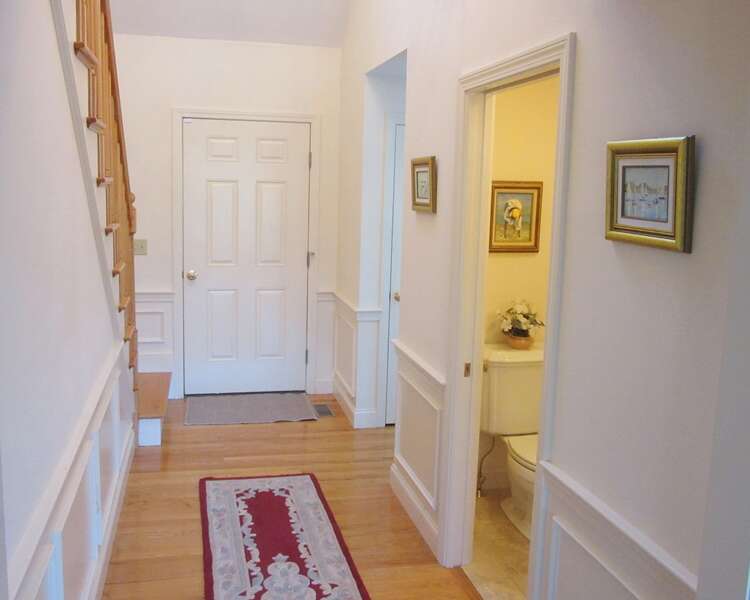 Entrance to the home - half bath off hall- 151 Sky Way Chatham Cape Cod New England Vacation Rentals