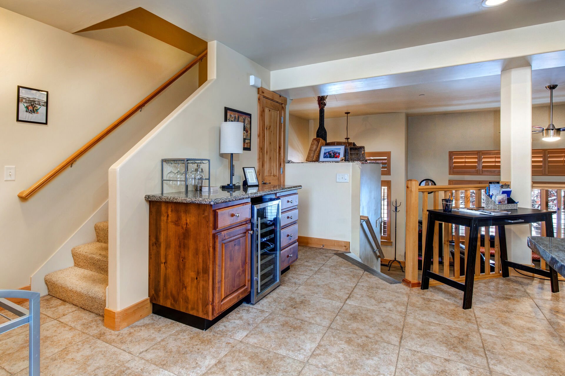 Kitchen with Stainless Steel Appliances, Ice-Maker, Wine Fridge, Stone Countertops, and Large Island with Seating for 4
