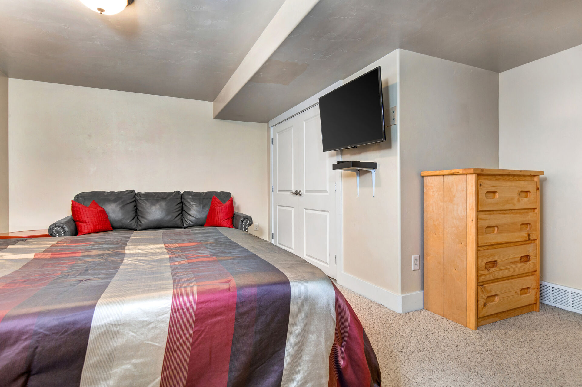 Bedroom 3 with Queen Bed, Sofa, Flat Screen TV, and Private Bathroom